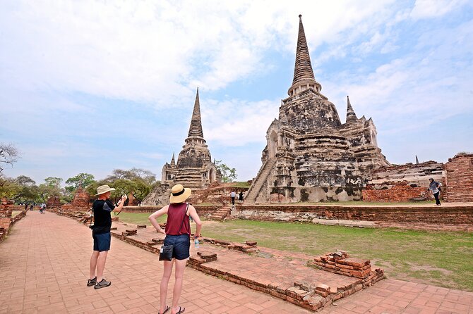 Ayutthaya Sunset Tour: UNESCO Temples & Peaceful River Cruise - Wat Mahathat and the Buddha in the roots