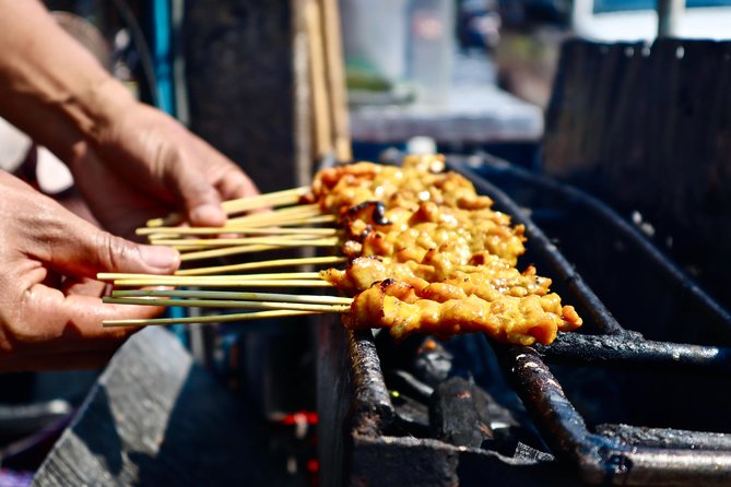 Bangkok by Night Food Tour with 10+ Tastings in Chinatown - Temples, prayer sticks, and more than food