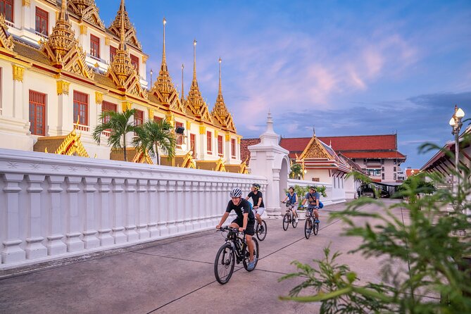 Bangkok: Night Bike Tour with Temples & Flower Market Visit - Loha Prasat and the Old City after sunset