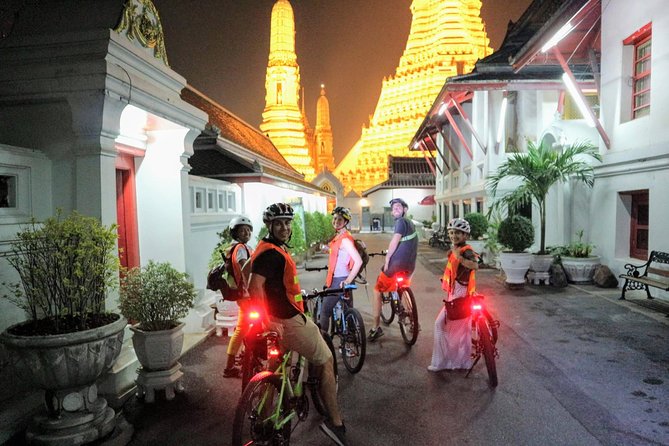 Bike Bangkok at Night with Thai Dinner - A local Thai dinner beneath a wooden family home
