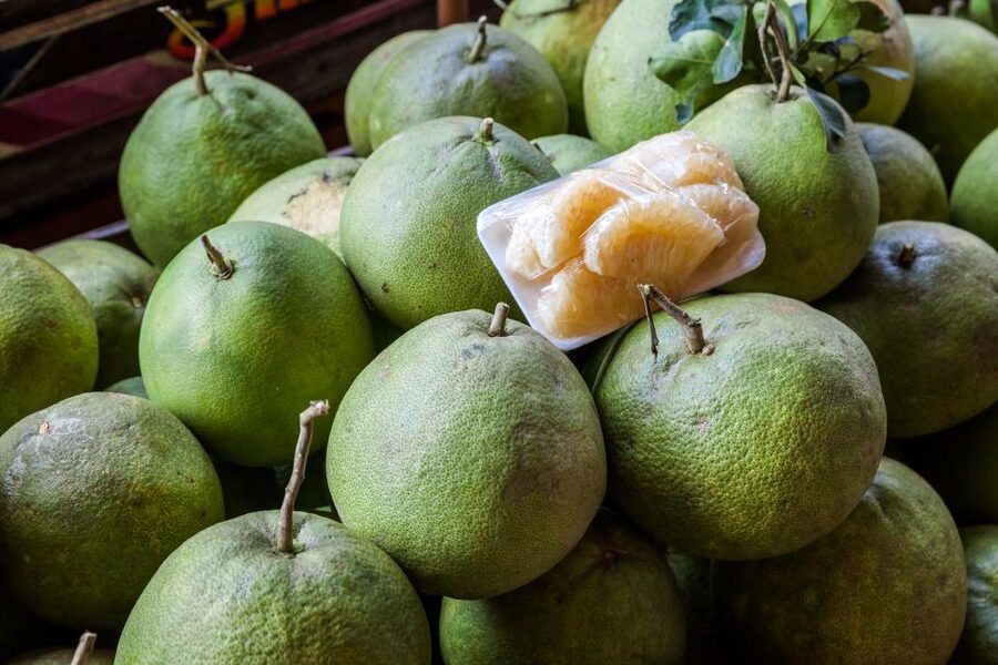 From Bangkok: Damnoen Saduak Floating Market Guided Tour - Through the narrow canals by paddle boat