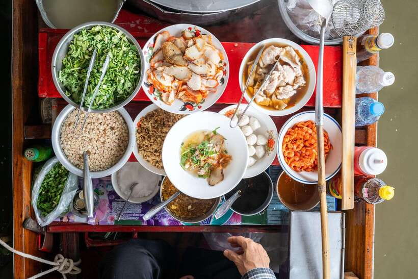 From Bangkok: Railway & Damnoen Saduak Floating Market Tour - Damnoen Saduak: food, boats, and careful browsing