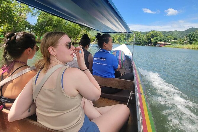 Kanchanaburi Full Day Tour: River Kwai and Erawan Falls - Reaching the River Kwai Bridge by Boat