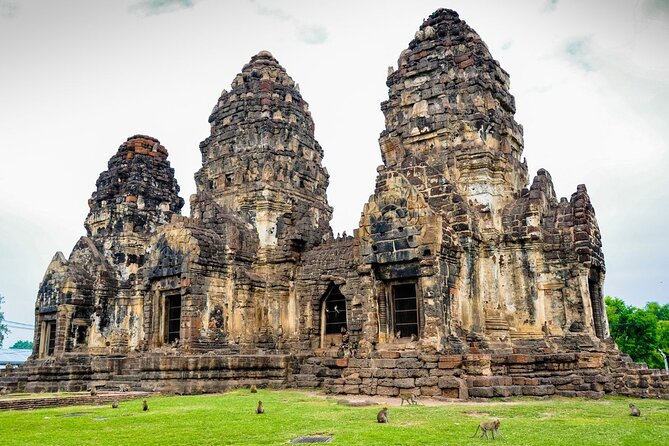 Lopburi Monkey Temple & Ayutthaya Old City Tour From Bangkok - Phra Prang Sam Yot: ruins with monkeys in the middle of town