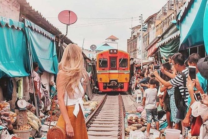 Maeklong Railway & Floating Market Tour (Private & All-Inclusive) - Maeklong Railway Market and the passing train