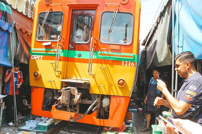 Maeklong Railway Market and Damnoen Saduak Floating Market Tour From Bangkok - Maeklong Railway Market and the moving awnings