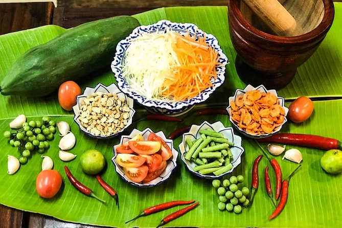Pink Chili - Thai Cooking Class and Market Tour in Bangkok - Choosing ingredients with Pimmy