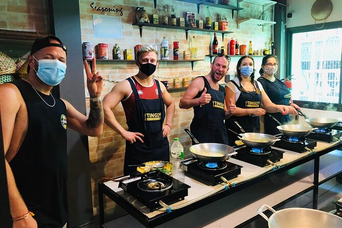 Thai cooking class experience in Bangkok with Tingly Thai cooking school - Instructors who keep the kitchen lively